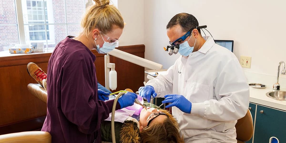 Dentist talking a patient through their treatment plan