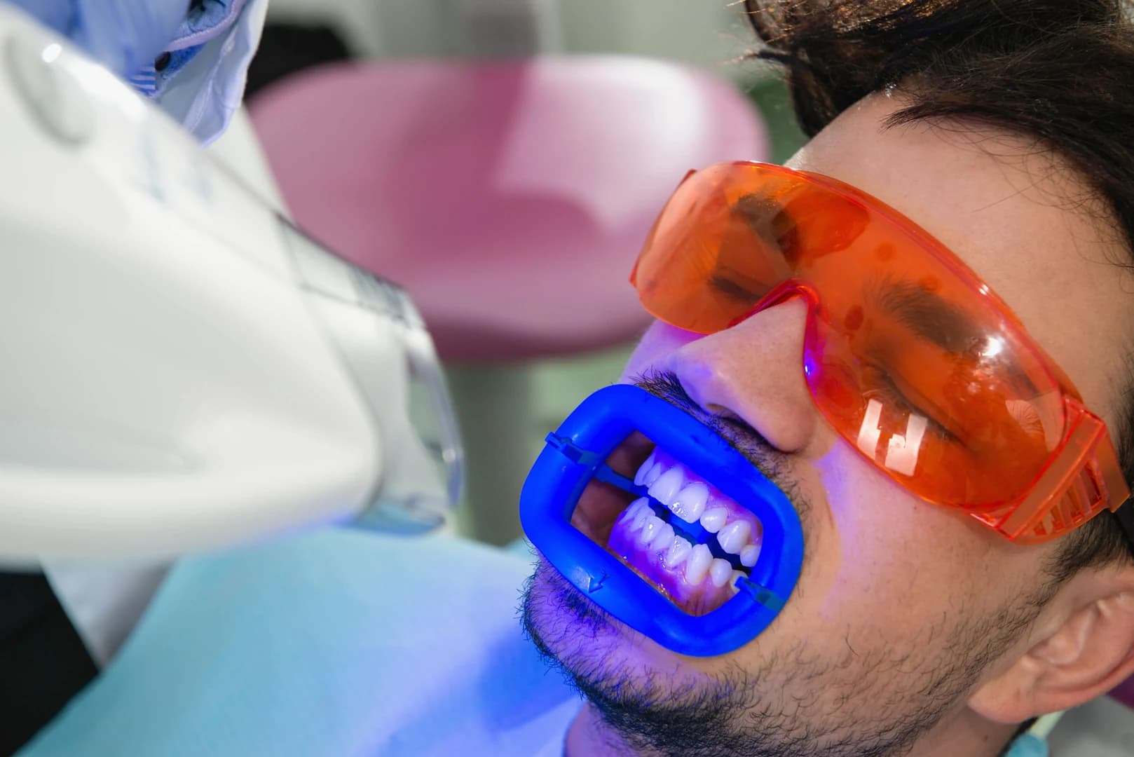 Patient with a bright, white smile after professional whitening
