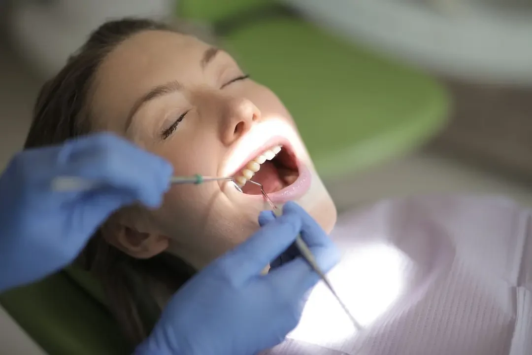 Patient smiling after receiving an immediate dental implant