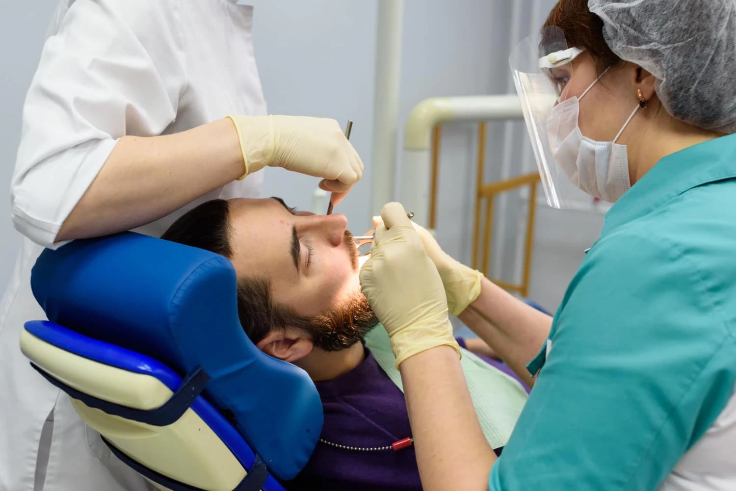 Dental specialist performing a procedure at Peterborough Family Dental