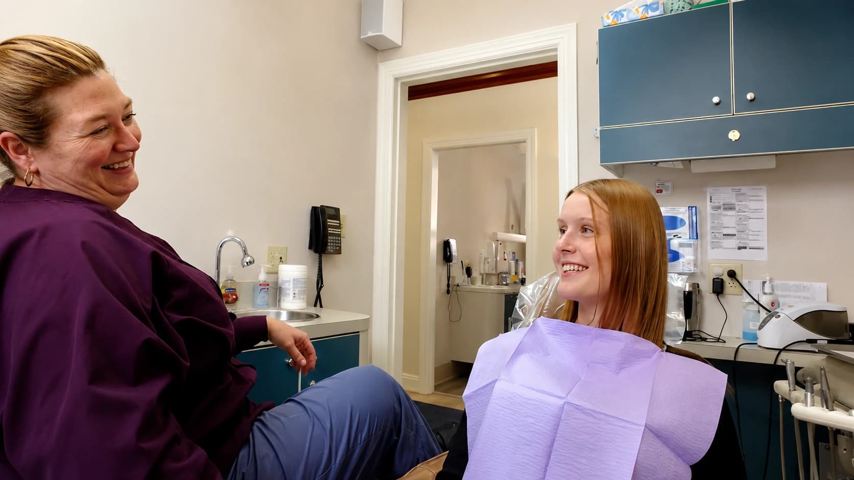 A relaxed, smiling patient in the dental chair