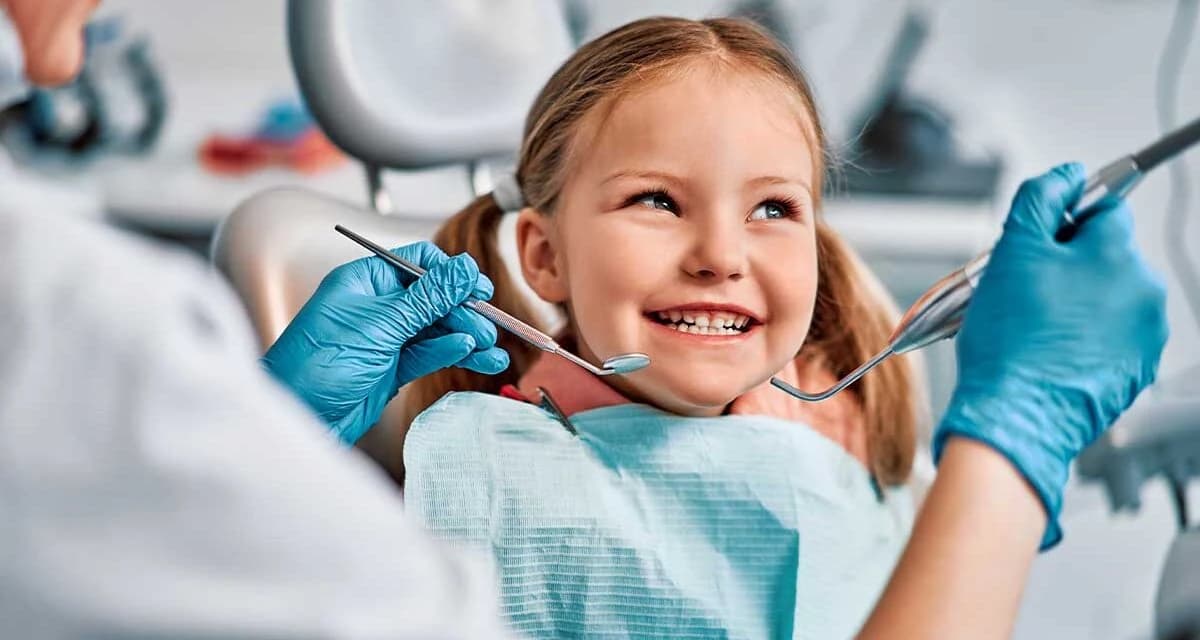 A young patient smiling at a dental visit