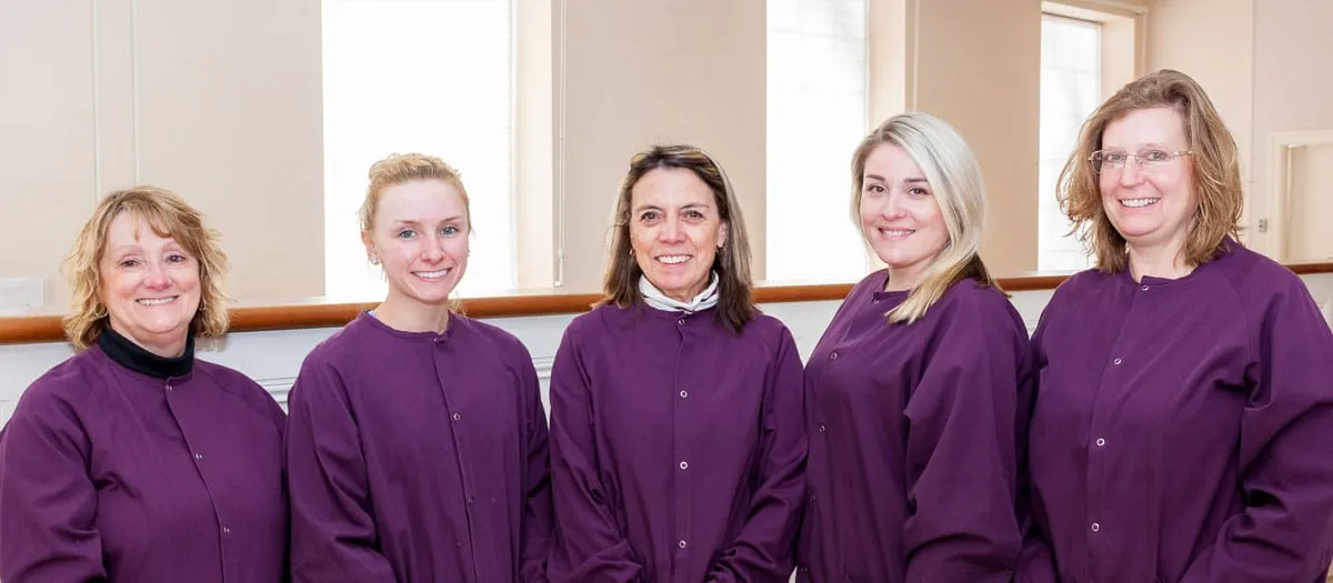 Our dental assistants in their scrubs at the practice