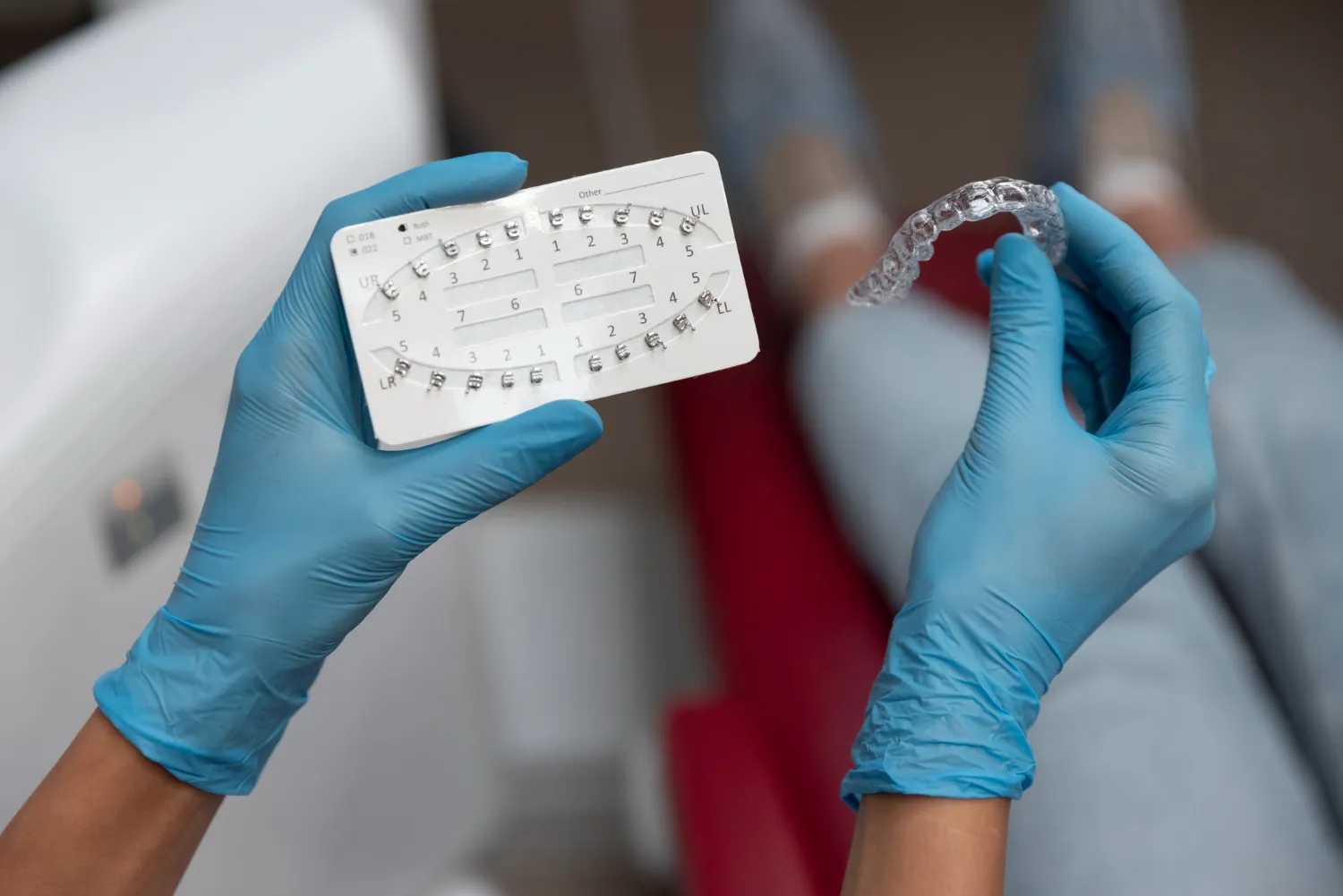 Patient with a straight smile protected by a retainer