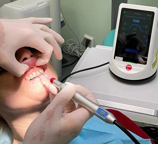 Our diode soft-tissue laser handpiece in a treatment room