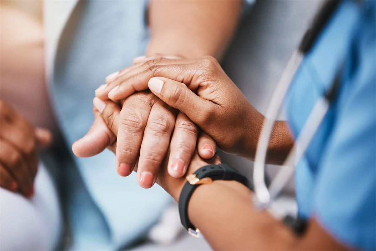 Older patient smiling warmly, cared for with respect