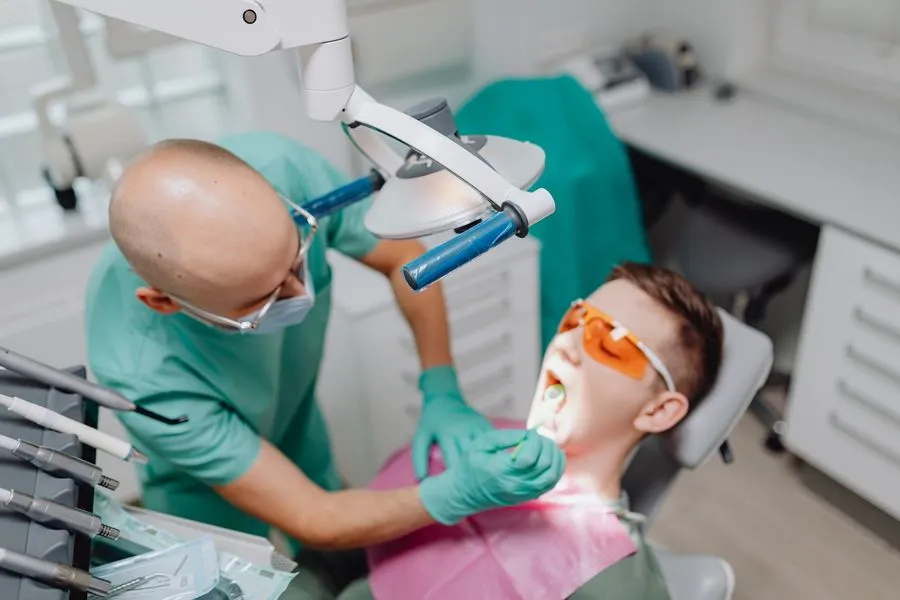 Dental hygienist performing a periodontal assessment