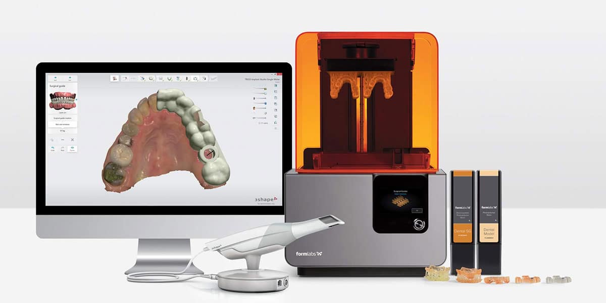 Digital Intraoral Scanner in front of monitor with digital impression